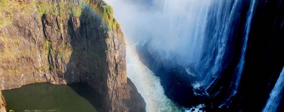 Victoria Falls with rainbow — one of the Seven Natural Wonders of the World